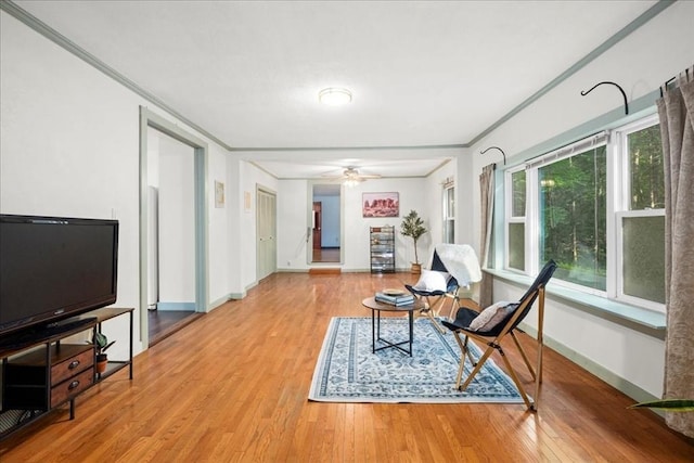 39 Mashapaug Rd, Sturbridge, MA 01566 - living area featuring wood finished floors, ornamental molding, and a ceiling fan