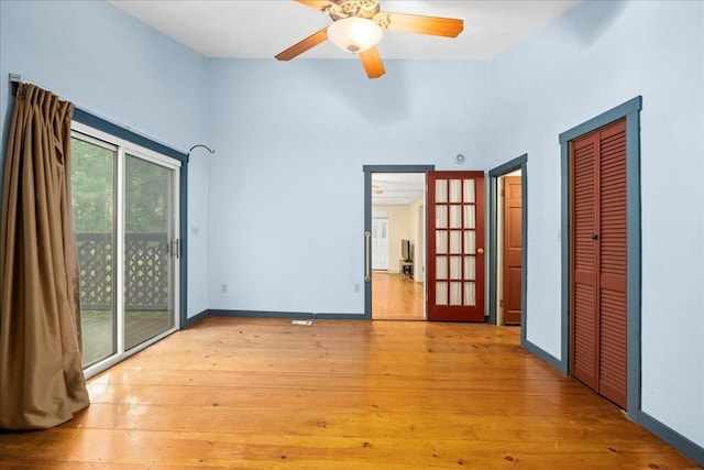 39 Mashapaug Rd, Sturbridge, MA 01566 - unfurnished bedroom with access to exterior, light wood finished floors, a high ceiling, ceiling fan, and a closet