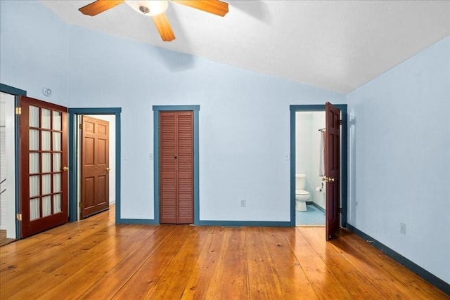 39 Mashapaug Rd, Sturbridge, MA 01566 - unfurnished bedroom featuring vaulted ceiling, wood-type flooring, a closet, ensuite bathroom, and ceiling fan