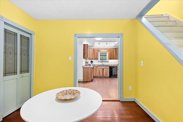 39 Mashapaug Rd, Sturbridge, MA 01566 - dining area featuring dark wood-type flooring and stairs