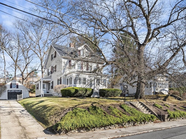 view of front of home with a front lawn and a chimney