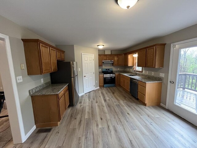 48 N Main St, New Salem, MA 01355 - kitchen featuring stainless steel appliances, a sink, under cabinet range hood, light wood-type flooring, and brown cabinets