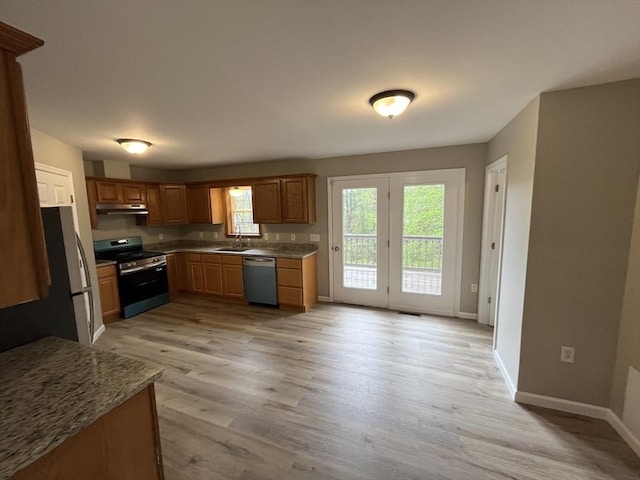 48 N Main St, New Salem, MA 01355 - kitchen with appliances with stainless steel finishes, under cabinet range hood, light wood-style flooring, and baseboards