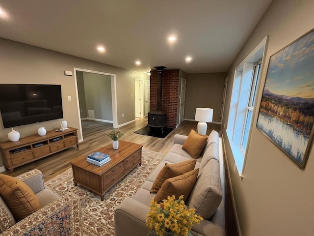 48 N Main St, New Salem, MA 01355 - living room with a wood stove, wood finished floors, baseboards, and recessed lighting
