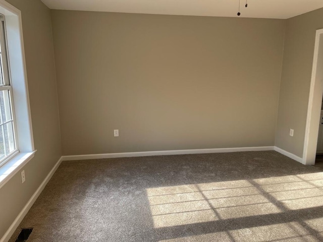 48 N Main St, New Salem, MA 01355 - empty room with dark carpet and baseboards