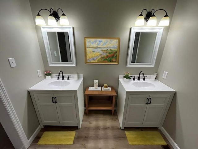 48 N Main St, New Salem, MA 01355 - bathroom featuring two vanities and wood finished floors