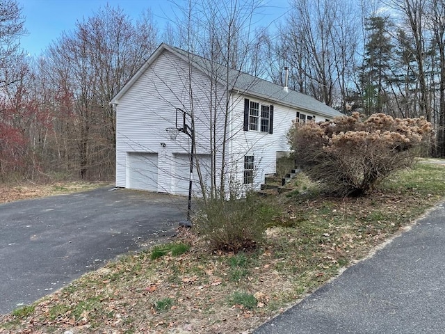 48 N Main St, New Salem, MA 01355 - view of side of property featuring asphalt driveway and a garage