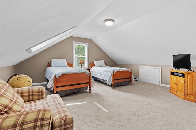 48 Gorham Ave, Stoneham, MA 02180 - bedroom featuring lofted ceiling, baseboards, light colored carpet, a skylight, and baseboard heating