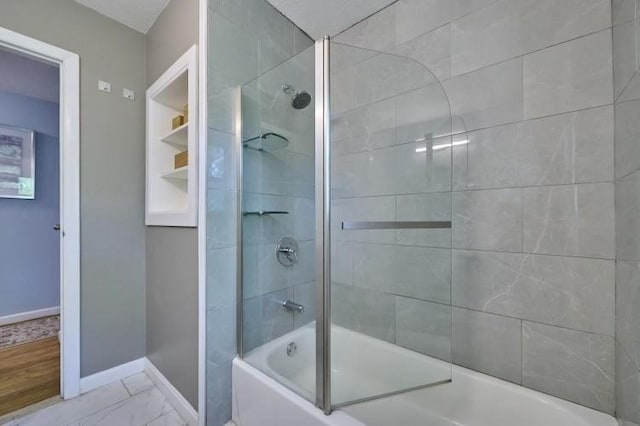 full bathroom with baseboards, enclosed tub / shower combo, and marble finish floors