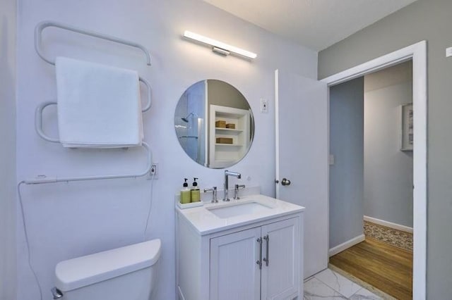 bathroom with toilet and vanity