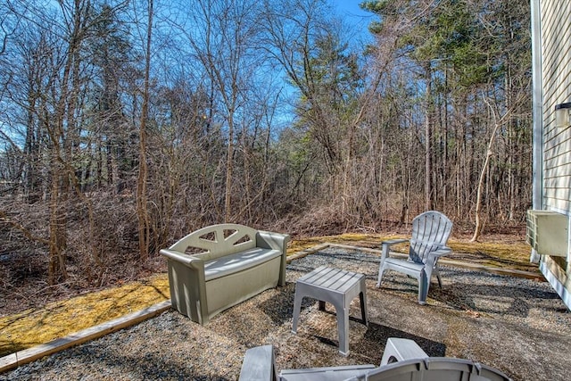 view of yard with a wooded view