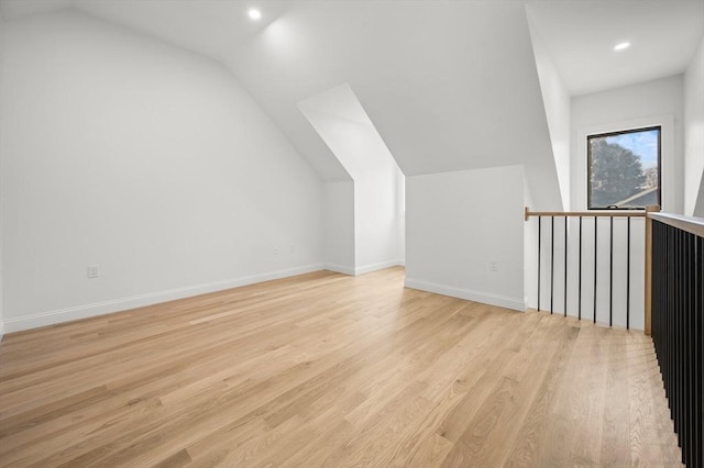 bonus room featuring recessed lighting, baseboards, light wood-type flooring, and lofted ceiling