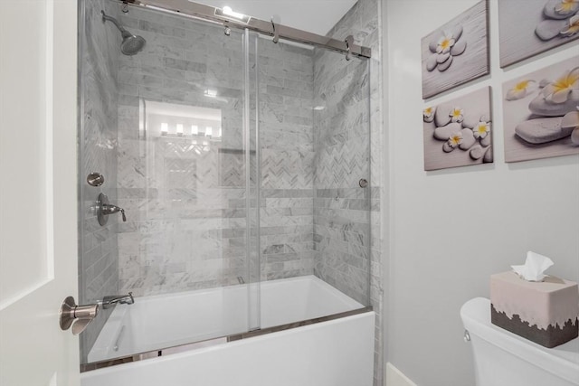 full bath with shower / bath combination with glass door and toilet