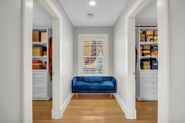 interior space featuring baseboards, visible vents, light wood-style flooring, and recessed lighting