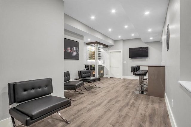 interior space featuring baseboards, recessed lighting, and wood finished floors