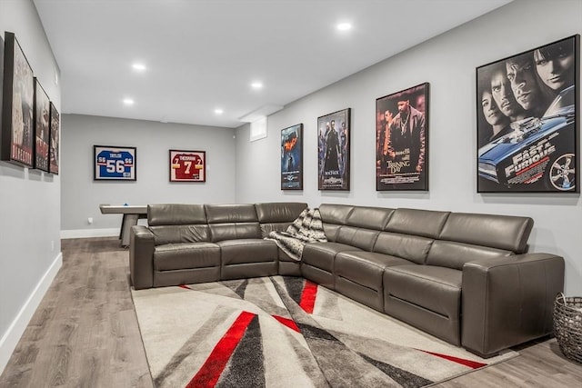 living room with baseboards, recessed lighting, and wood finished floors