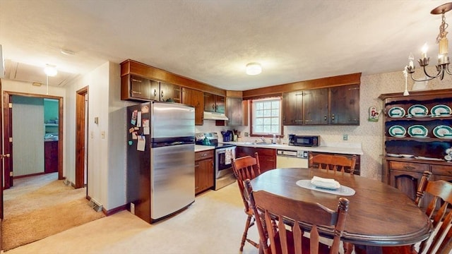 10 Briarwood Rd, Woburn, MA 01801 - kitchen with appliances with stainless steel finishes, under cabinet range hood, light carpet, light countertops, and a chandelier