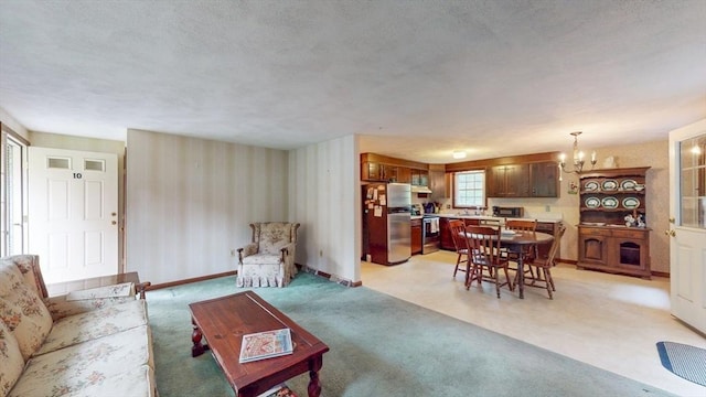 10 Briarwood Rd, Woburn, MA 01801 - living room featuring wallpapered walls, a chandelier, light colored carpet, and baseboards