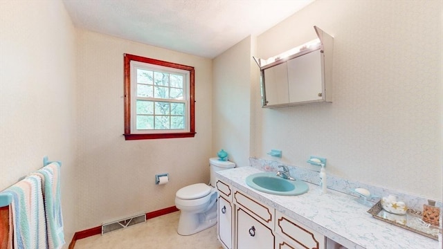 10 Briarwood Rd, Woburn, MA 01801 - bathroom with vanity, toilet, and baseboards