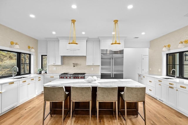 38 Old Shipyard Ln, Hanover, MA 02339 - kitchen featuring appliances with stainless steel finishes, a sink, a kitchen island, backsplash, and recessed lighting