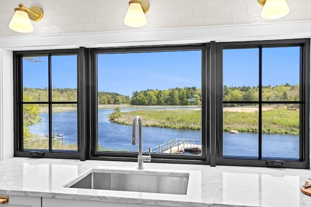 38 Old Shipyard Ln, Hanover, MA 02339 - kitchen view of a water view, a sink, and light stone countertops