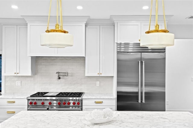 38 Old Shipyard Ln, Hanover, MA 02339 - kitchen with high end appliances, white cabinetry, light stone counters, and recessed lighting