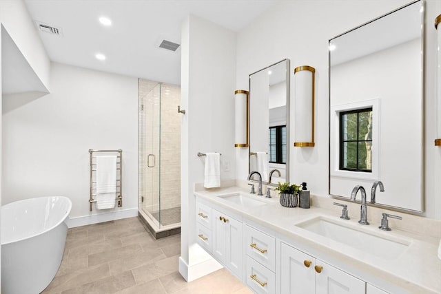 38 Old Shipyard Ln, Hanover, MA 02339 - bathroom featuring a shower stall, recessed lighting, a freestanding tub, and double vanity