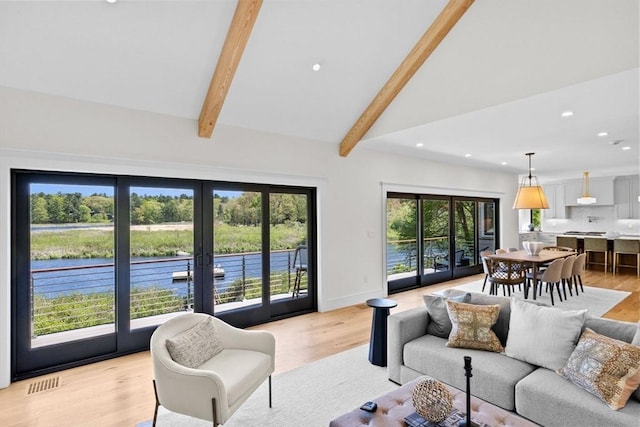 38 Old Shipyard Ln, Hanover, MA 02339 - living area with french doors, beam ceiling, recessed lighting, light wood-style flooring, and high vaulted ceiling