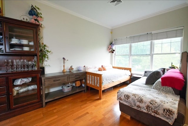 35 Commonwealth Ave Unit 404, Newton, MA 02467 - bedroom featuring crown molding and light wood-style flooring