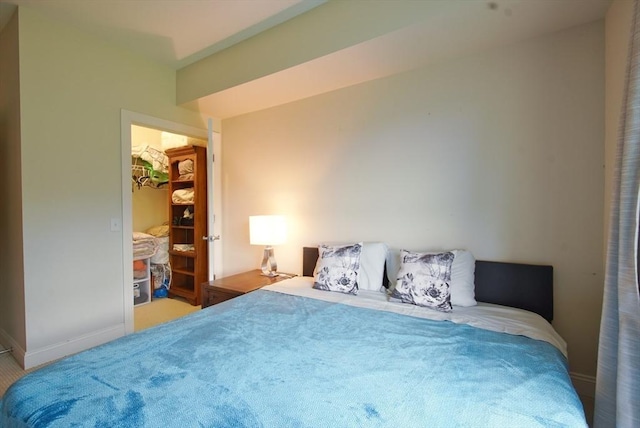 35 Commonwealth Ave Unit 404, Newton, MA 02467 - bedroom with carpet, baseboards, a spacious closet, and a closet