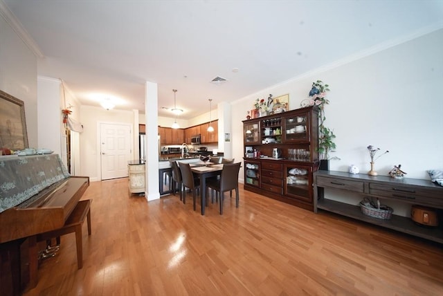 35 Commonwealth Ave Unit 404, Newton, MA 02467 - dining space featuring ornamental molding and light wood-style flooring