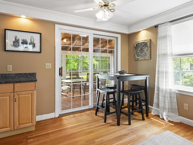 34 Kinsley Rd, Acton, MA 01720 - dining room with ornamental molding, baseboards, ceiling fan, and light wood-style flooring