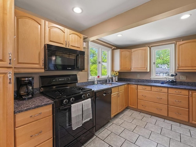 34 Kinsley Rd, Acton, MA 01720 - kitchen with black appliances, light brown cabinetry, a sink, light tile patterned floors, and dark stone counters