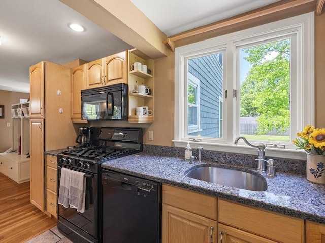 34 Kinsley Rd, Acton, MA 01720 - kitchen featuring black appliances, a sink, healthy amount of natural light, and dark stone counters
