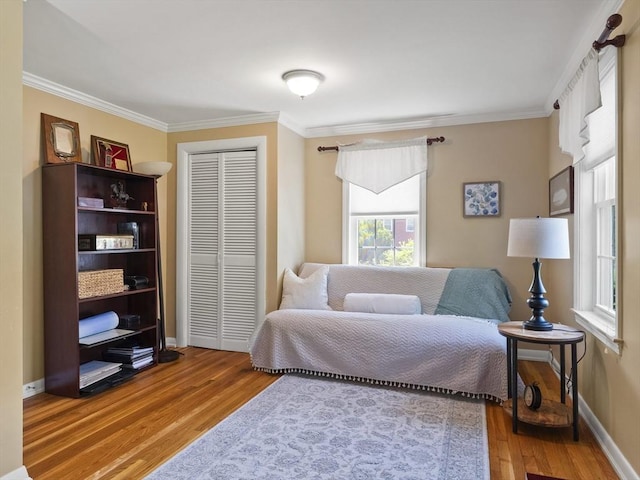 34 Kinsley Rd, Acton, MA 01720 - bedroom featuring ornamental molding, wood finished floors, a closet, and baseboards