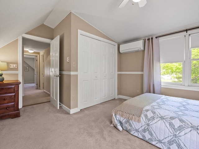 34 Kinsley Rd, Acton, MA 01720 - carpeted bedroom featuring a wall mounted AC, vaulted ceiling, a closet, a ceiling fan, and baseboards
