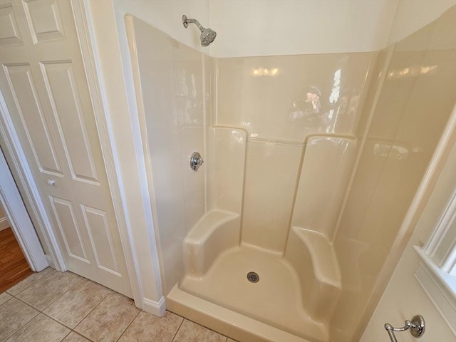 bathroom featuring tile patterned floors and walk in shower