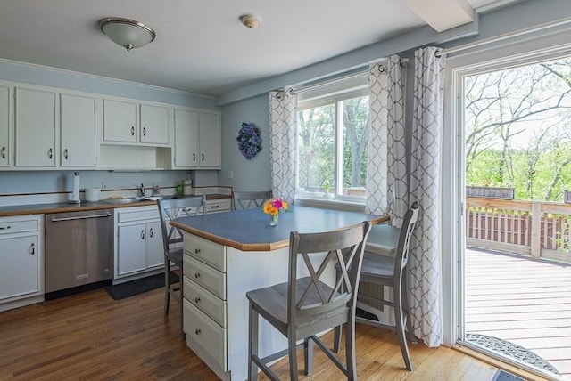 17 Woodcliff Rd, Quincy, MA 02169 - kitchen featuring dishwasher, a kitchen breakfast bar, dark wood finished floors, a peninsula, and a sink