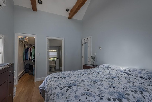 17 Woodcliff Rd, Quincy, MA 02169 - bedroom featuring a walk in closet, high vaulted ceiling, light wood-style floors, beam ceiling, and baseboard heating