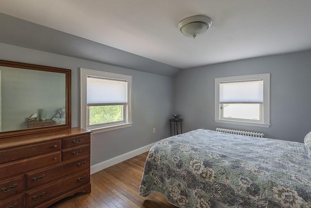 17 Woodcliff Rd, Quincy, MA 02169 - bedroom featuring radiator, light wood finished floors, vaulted ceiling, and baseboards