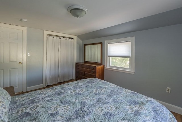 17 Woodcliff Rd, Quincy, MA 02169 - bedroom featuring baseboards, vaulted ceiling, and wood finished floors