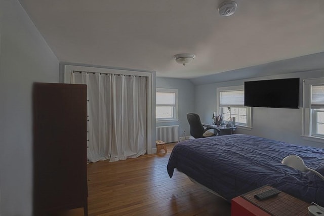 17 Woodcliff Rd, Quincy, MA 02169 - bedroom featuring radiator heating unit and wood finished floors