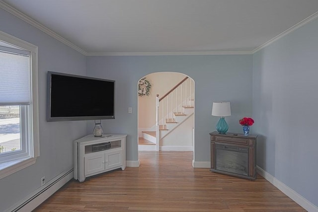 17 Woodcliff Rd, Quincy, MA 02169 - living room featuring baseboard heating, wood finished floors, stairs, ornamental molding, and baseboards