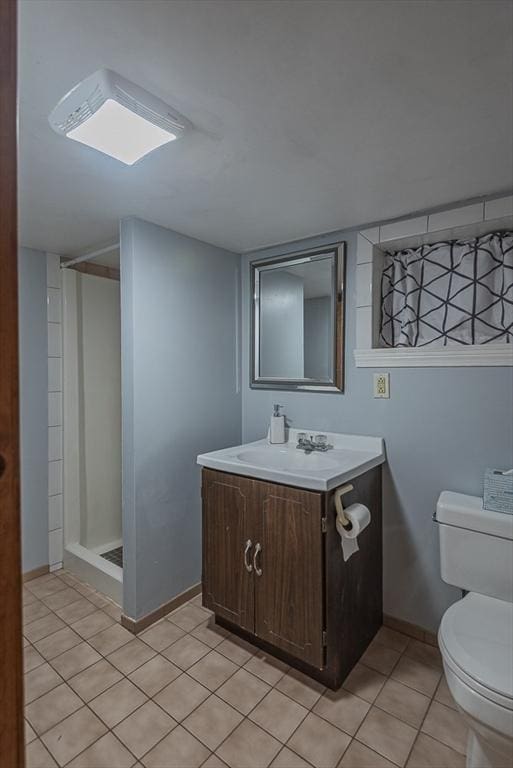 17 Woodcliff Rd, Quincy, MA 02169 - full bath featuring toilet, vanity, a stall shower, and tile patterned flooring
