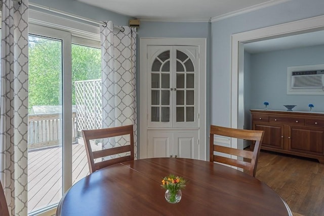 17 Woodcliff Rd, Quincy, MA 02169 - dining area featuring wood finished floors, a wall unit AC, and crown molding