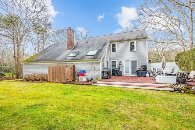 56 Allan Rd, Barnstable, MA 02668 - back of house featuring a chimney, a deck, and a shingled roof