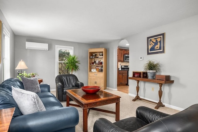 carpeted living room with a wealth of natural light and a wall mounted AC