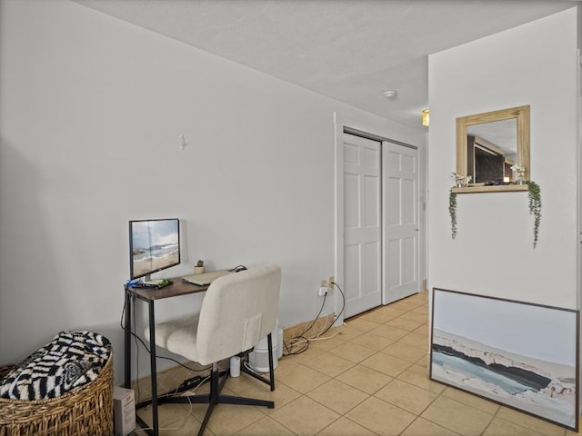 home office with light tile patterned floors