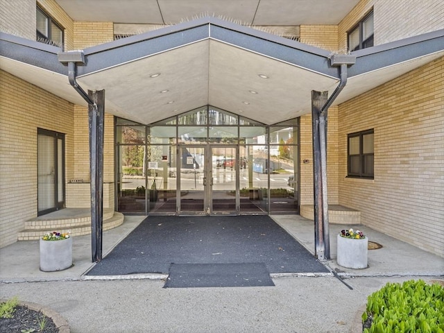 entrance to property with brick siding