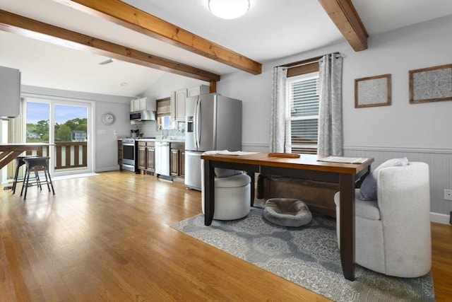 121 Lynnfield St, Lynn, MA 01904 - dining area featuring beamed ceiling, light wood finished floors, and a wainscoted wall